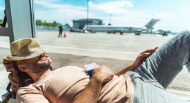 traveler sleeping in airport