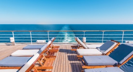 Cruise Ship Vacation. Sea Travel Concept with Deckchairs on the Vessel Deck.