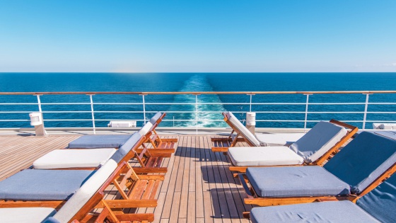 Cruise Ship Vacation. Sea Travel Concept with Deckchairs on the Vessel Deck.