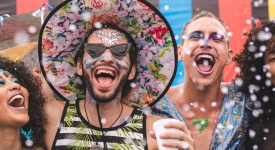 four friends celebrating looking happy